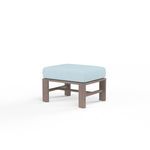 Outdoor Laguna Ottoman with driftwood-finish aluminum frame and light blue plush 6-inch cushion