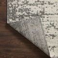 Corner folded back revealing the textured underside of Rainier Ivory / Grey Rug