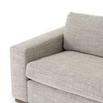 Close corner interior view showing soft cushions and thick armrest design