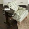 Casey Side Table styled next to patterned armchair on dark hardwood floor with books and decor on top