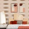 Wallpaper shown applied in a bedroom setting with bed, artwork, mirror, and side tables, showcasing scale and room context