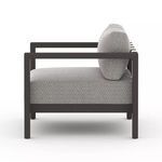 Side profile of Sonoma Faye Ash Outdoor Chair highlighting thick cushions and open armrests