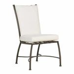 Front angle of chair with white cushions on curved metal frame