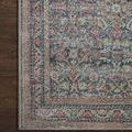 Top-down view of corner section showing detailed weave and muted pastel color variation on the rug