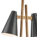 Close-up of lamp base angles with warm brass finish and squared corners