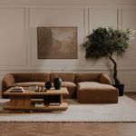 Wide shot of modern living room with Casey coffee table centered on a plush cream carpet