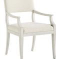 Ridge Dining Arm Chair angled view highlighting curved armrests and tapered legs