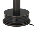 Close-up of ribbed base with subtle bronze accent lines on Traverse lamp