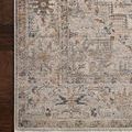 Zoomed view highlighting rug’s muted gold and beige colors with fine woven details on dark wood