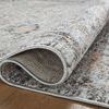 Monroe rug partially rolled exposing dense polyester pile and stitched edges