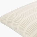 Close-up side angle showing texture and linen fabric weave on ivory striped pillow