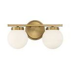 Front view showing the brushed brass circular backplate of the bath light