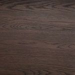 Extreme close-up of wood grain pattern on dark stained oak surface of the buffet