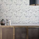 Wild Chervil wallpaper shown as a full room wall with vintage-inspired sideboard and decorative vases