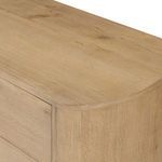 Close-up of top surface angled showing subtle wood texture and rounded edges