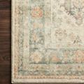 Close-up of Rosette rug pile and pattern detail on dark wooden floor