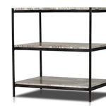 Top close-up view showing marble shelf corner with rounded iron frame edge
