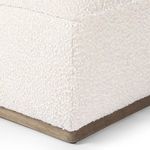 Close-up detail on corner seam and wooden base edge with fabric texture