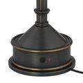 Close-up of lamp base with power button glowing red on dark bronze metal finish