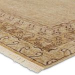 Repeat close-up of rug corner showing intricate distressed border and wool fringe