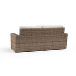 Back view showing woven wicker texture and straight armrests of Havana Loveseat