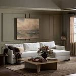 Wickham sectional styled in a moody living room with wood coffee table and muted art
