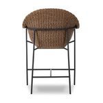Rear view showing rounded back and iron leg frame of woven outdoor counter stool