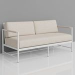 Front side angle view of Sabbia Loveseat against gray wall showing rounded tube frame detail