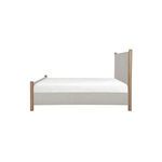 Side view of Warren Bed highlighting the headboard height and bed frame depth in beige upholstery