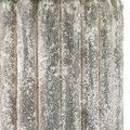 Close-up of the lamp's weathered concrete base showing stippled texture and furrowed vertical grooves