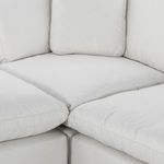 Close-up inside corner of sectional highlighting cushioned junction and upholstery