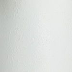 Close-up texture showing slightly uneven smooth white wood surface of cylindrical base