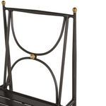 Repeated close-up of top back corner decorative brass finials