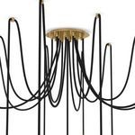 Detailed view of Spider Chandelier brass ceiling plate with multiple black cords extending outward
