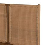 Close-up of woven rattan headboard panel showing woven pattern and wood supports