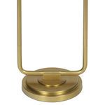 Close-up of round natural brass lamp base with layered design