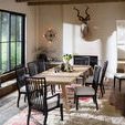 Miller Dining Table in rustic dining room with black spindle-back chairs and natural light