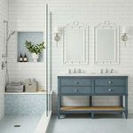 Sienna vanity styled in a white-tiled bathroom with two mirrors, chrome faucets, and a blue honeycomb tile shower with bench
