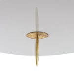 Close-up view of antiqued gold finial and underside of black shade