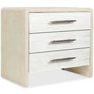 Cascade lacquered nightstand with three soft white chalk finish drawers, champagne bar-pull hardware, and pebble beach bur...