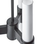 Close-up from top corner showing white glass pillar edges and black metal arms of Dixon Pendant