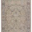 Low-pile traditional rug with faded green, blue, tan tones and an ornate Old World-inspired pattern