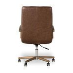 Rear view showing smooth leather back without tufting and chrome base with caster wheels.