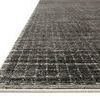 Close-up angled view showing low pile texture and light gray binding edge of the Beverly Charcoal rug