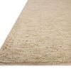 Side angle close-up of Penny Gold/Natural Rug edge showing soft pile thickness against white background