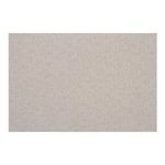 Detailed fabric swatch of light beige slipcover material with subtle texture