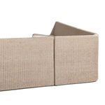 Joint between two sections from front angle with fabric cushions and rattan frame visible