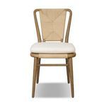Greylin Dining Chair with woven backrest, curved wood frame, and cream cushion tied with fabric cords