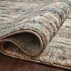 Close-up of Spirit Stone Blue Rug folded, highlighting dense polypropylene pile and edge binding