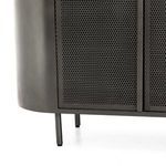 Side angle showing perforated metal doors and rounded gunmetal body on raised metal legs